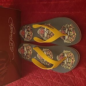 New Ed Hardy men's flip flops size 10. Yellow and navy with the tiger!